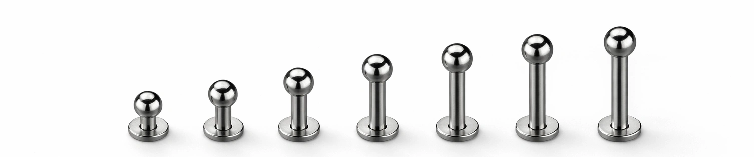Titanium labret posts arranged by size range and length